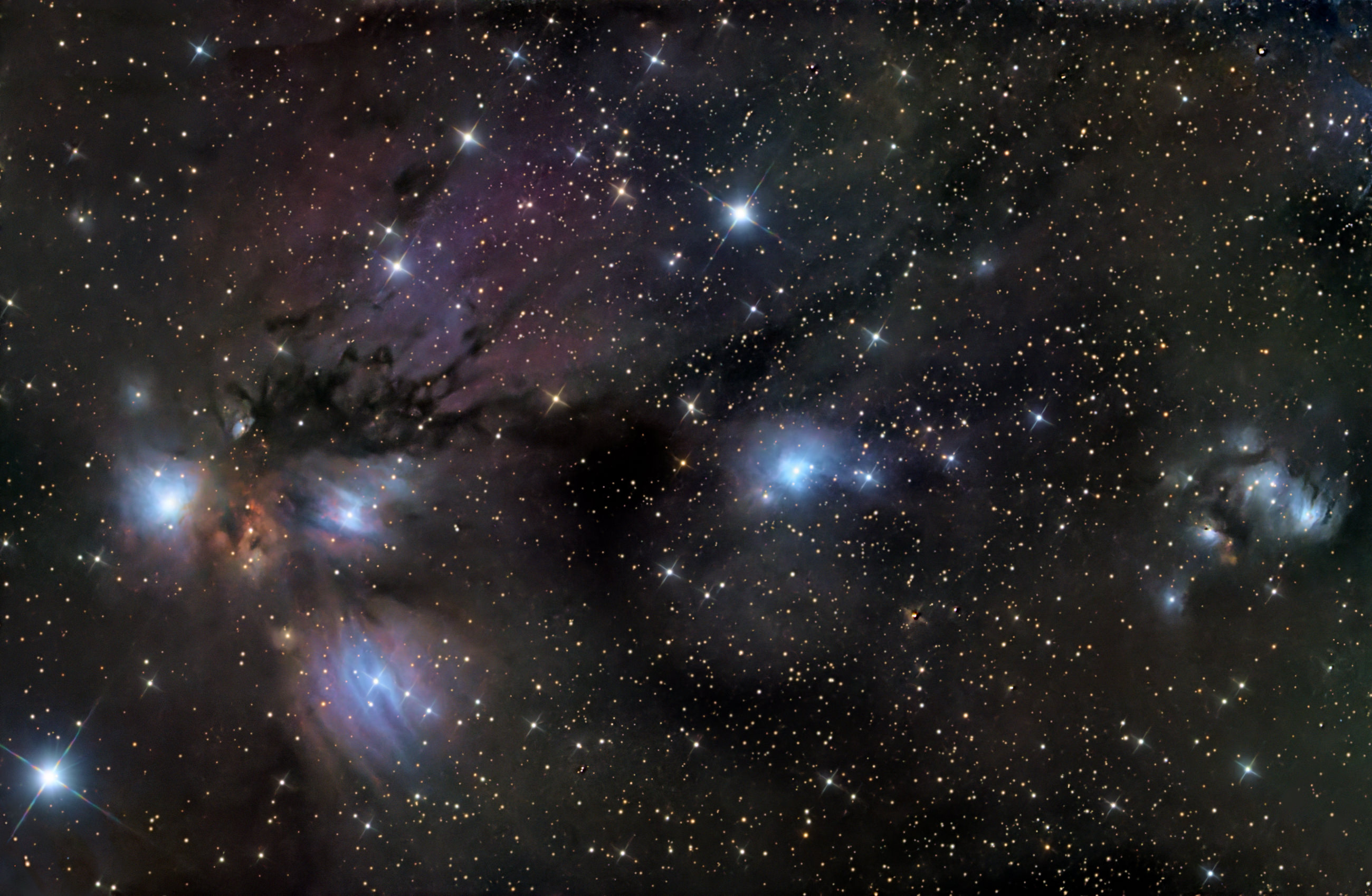 The colorful nebula complex in the left part of the image is the Angel Nebula in the constellation Monoceros. To its right are the bluish reflection nebulae VdB 72 and VdB 73.